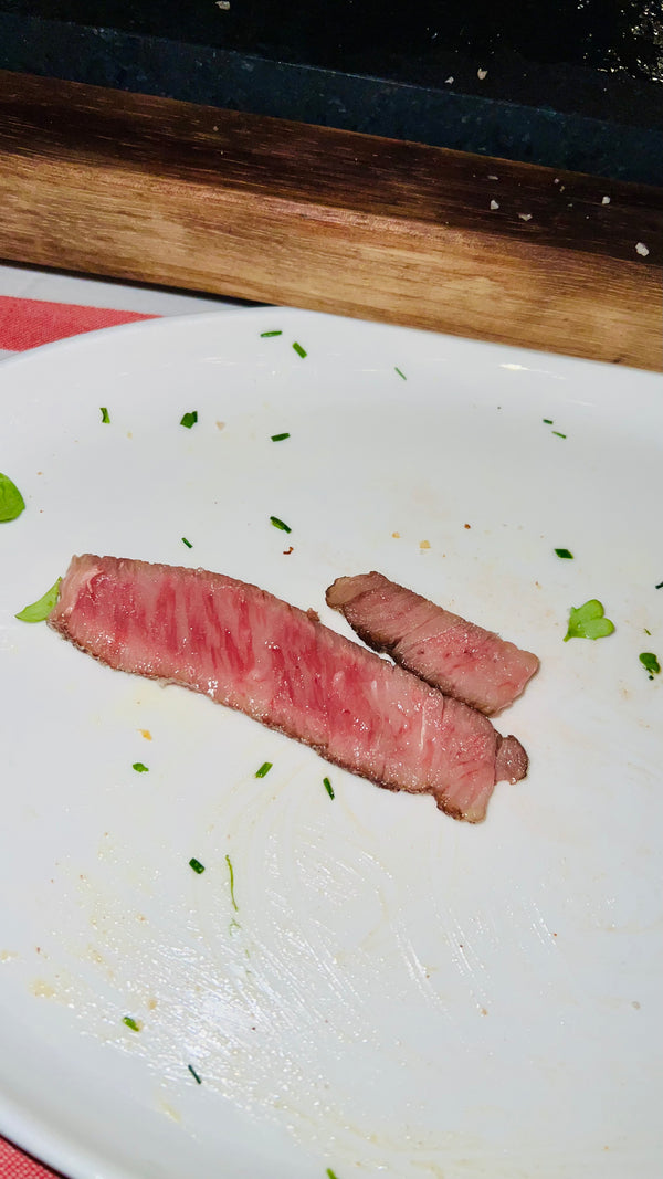 Picture of a slice of Wagyu on an empty plate